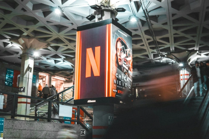 A large netflix sign hangs in a public space